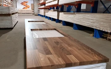 Buy Kitchen worktop from dark walnut wood with a cutout for a sink and stove