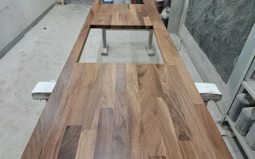 Buy Kitchen worktop from dark walnut wood with a cutout for a sink and stove